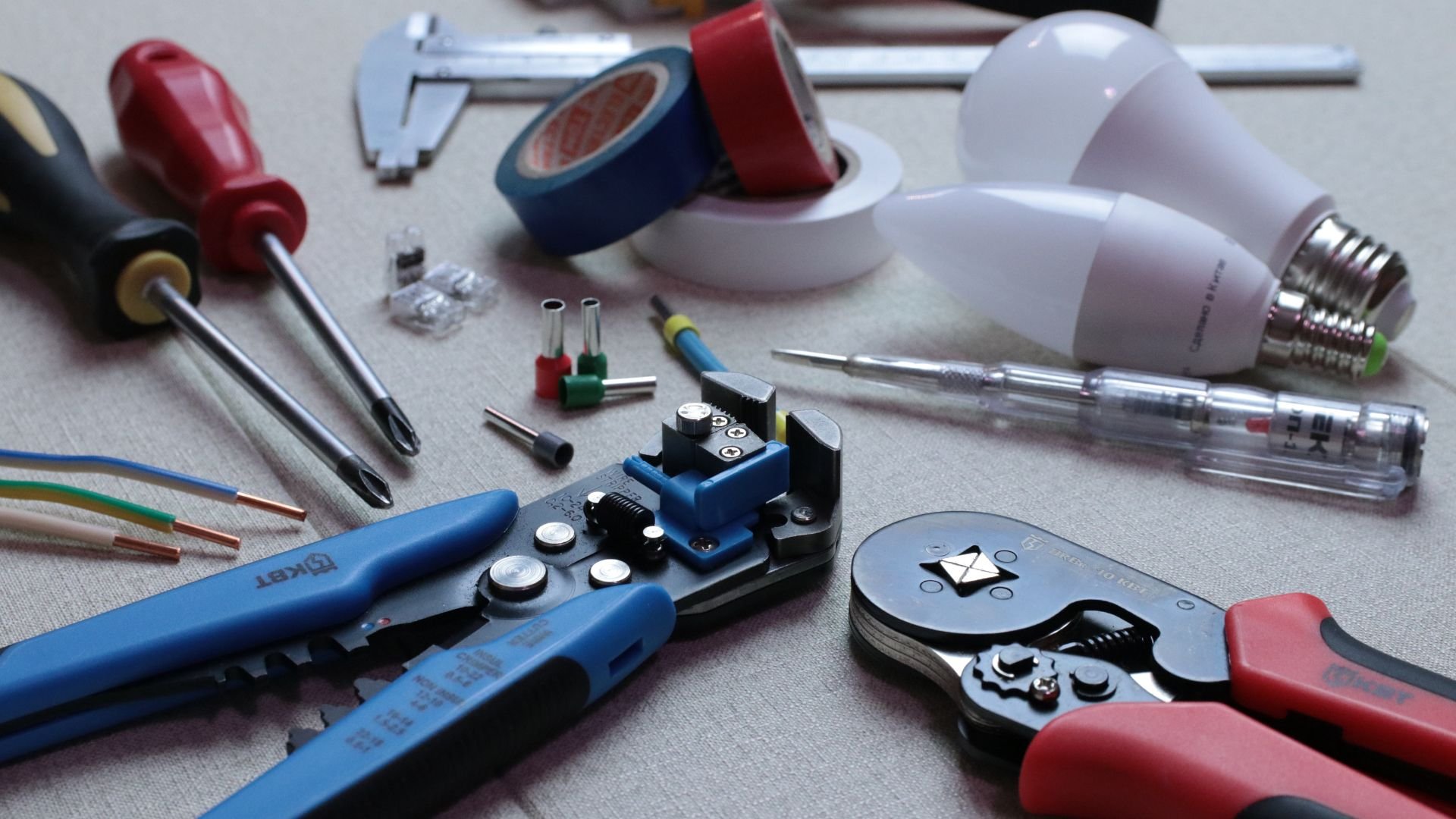 Electrical tools and components including wire strippers, bulbs, and screwdrivers